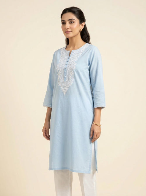 Ayzal powder blue embroidered cambric kurta by NAAZPOSH, full length front view